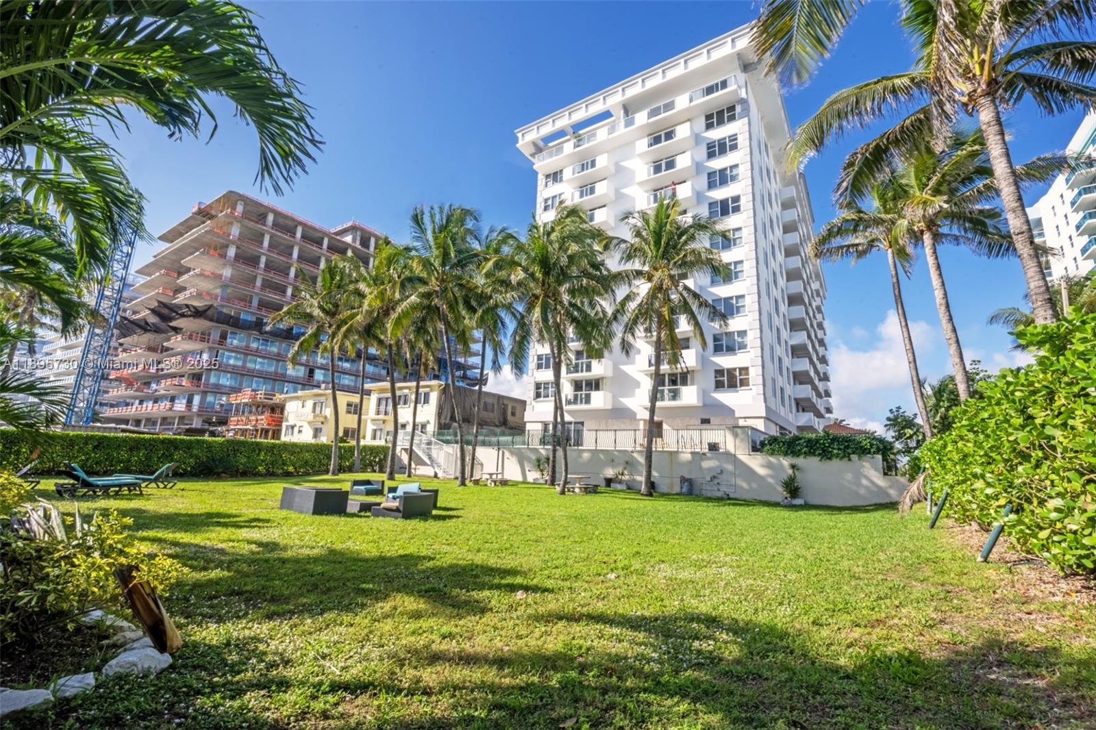 9195 Collins Avenue, Unit 812 Surfside, FL 33154 - Photo 4 of 20 a garden with tall trees