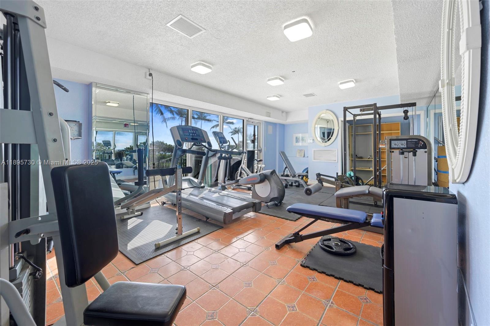 9195 Collins Avenue, Unit 812 Surfside, FL 33154 - Photo 6 of 20 a view of a livingroom with furniture and a couch