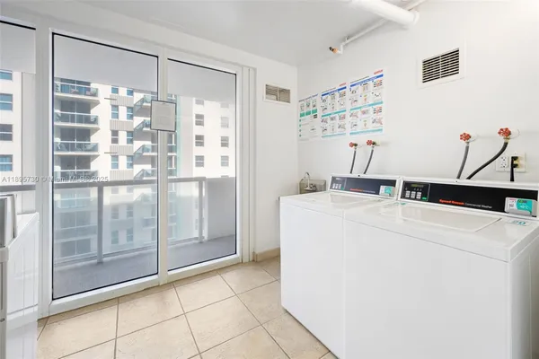 a utility room with shower and mirror