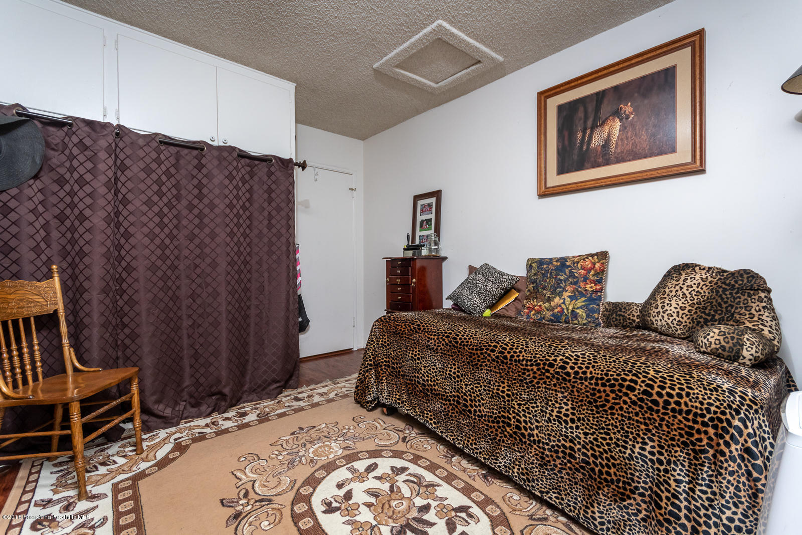 7871 Denivelle Road Sunland, CA 91040 - Photo 22 of 48 a bedroom with bed and wooden floor