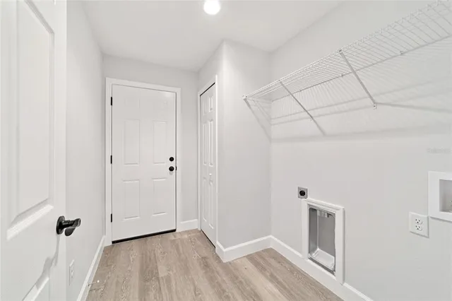 a view of a livingroom with wooden floor