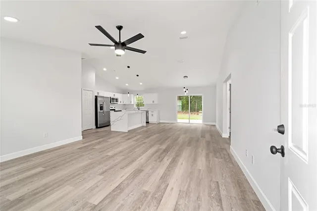 a view of a kitchen with a sink and a window