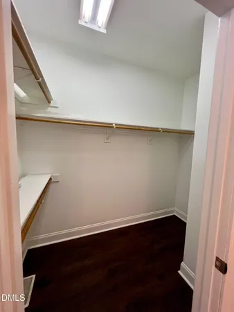 an empty room with wooden floor