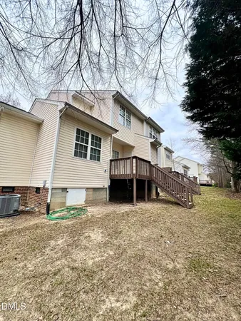 a view of a house with a yard covered in snow