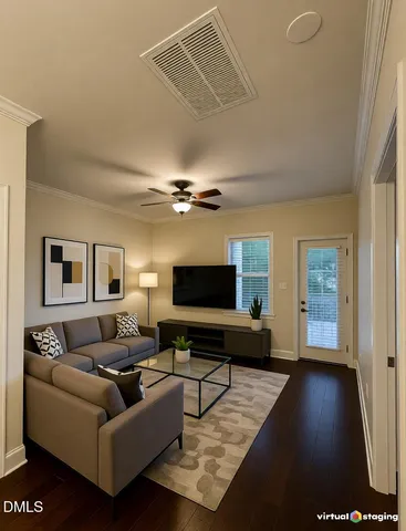 a living room with furniture and a flat screen tv