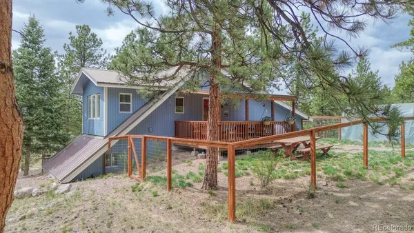 a house that has tree in front of it