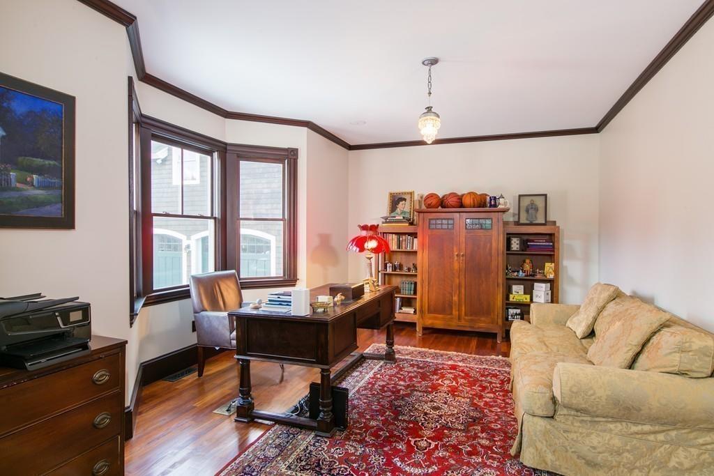 106 Koning Farm Road Carlisle, MA 01741 - Photo 13 of 39 a living room with furniture a flat screen tv and a window