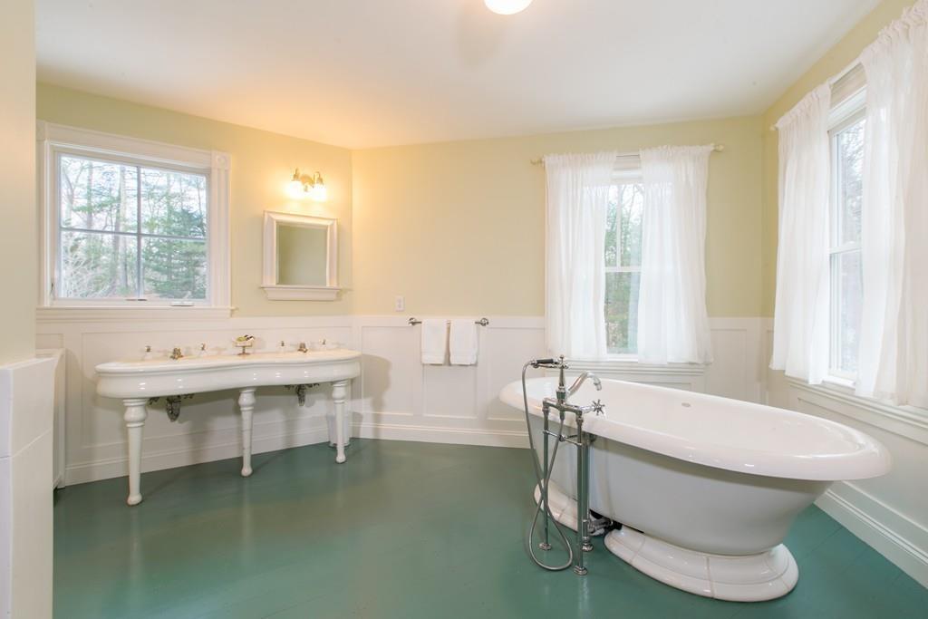 106 Koning Farm Road Carlisle, MA 01741 - Photo 17 of 39 a bathroom with a sink and a large mirror