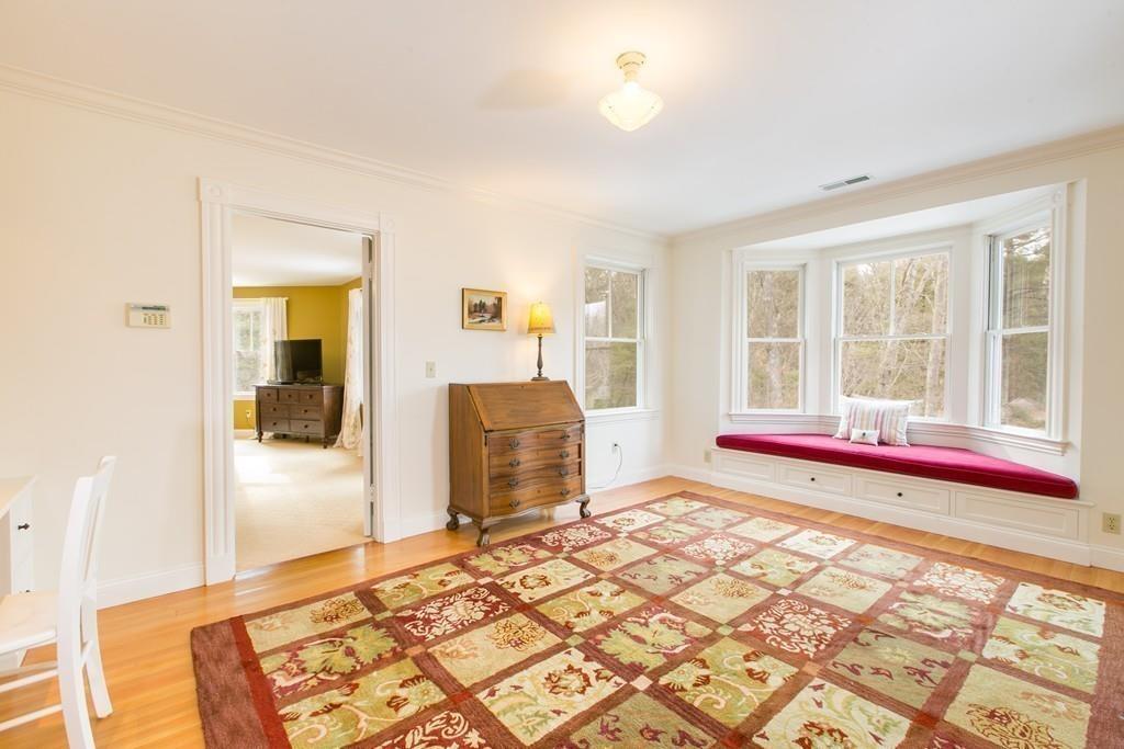 106 Koning Farm Road Carlisle, MA 01741 - Photo 20 of 39 a view of a bedroom with wooden floor and windows