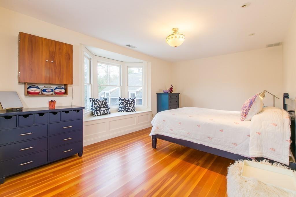 106 Koning Farm Road Carlisle, MA 01741 - Photo 23 of 39 a spacious bedroom with a bed and wooden floor