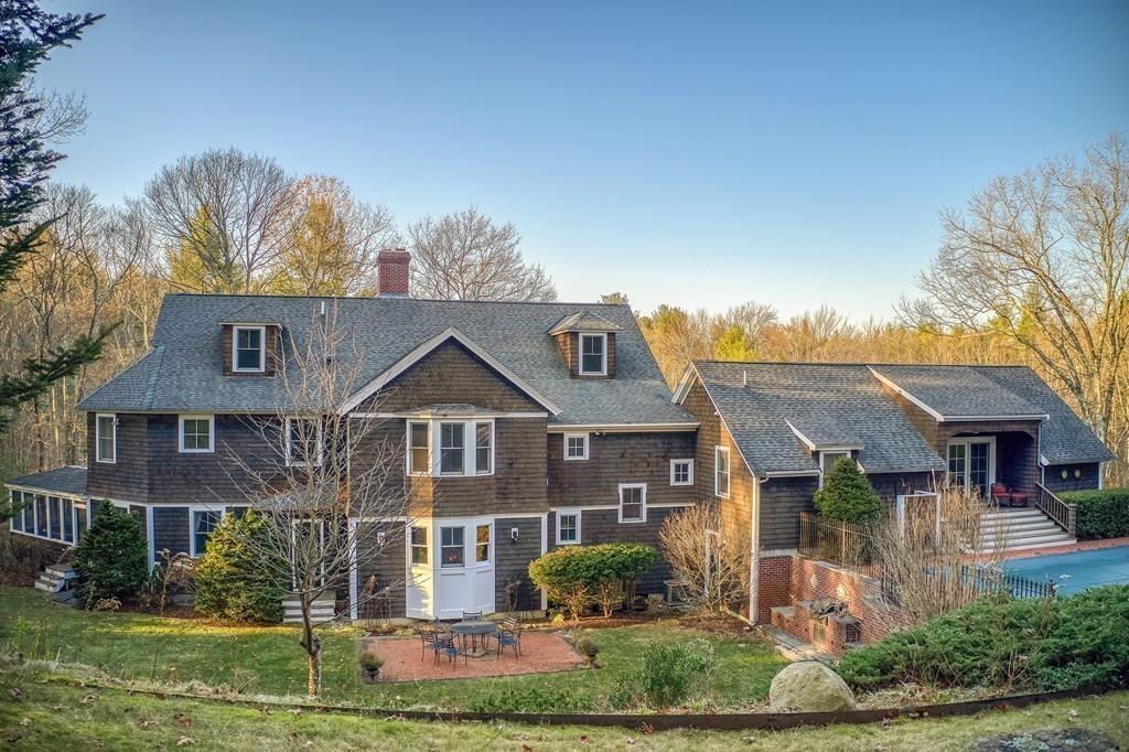 106 Koning Farm Road Carlisle, MA 01741 - Photo 27 of 39 a front view of a house with a yard and potted plants