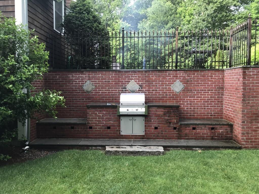 106 Koning Farm Road Carlisle, MA 01741 - Photo 30 of 39 a view of a bench in the backyard