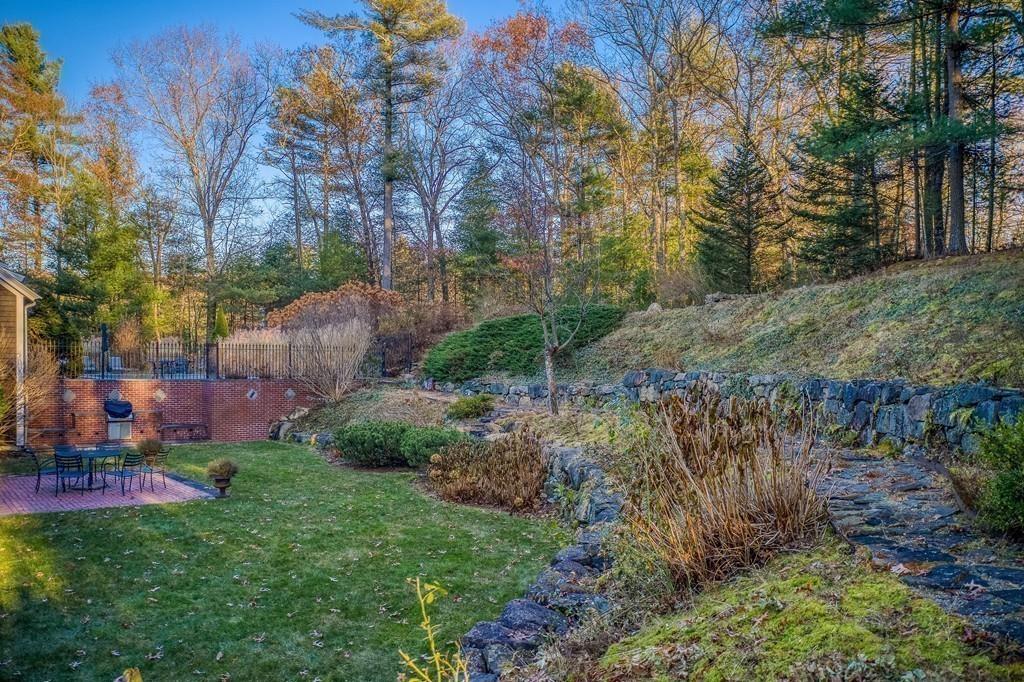 106 Koning Farm Road Carlisle, MA 01741 - Photo 31 of 39 a view of a garden with a building in the background