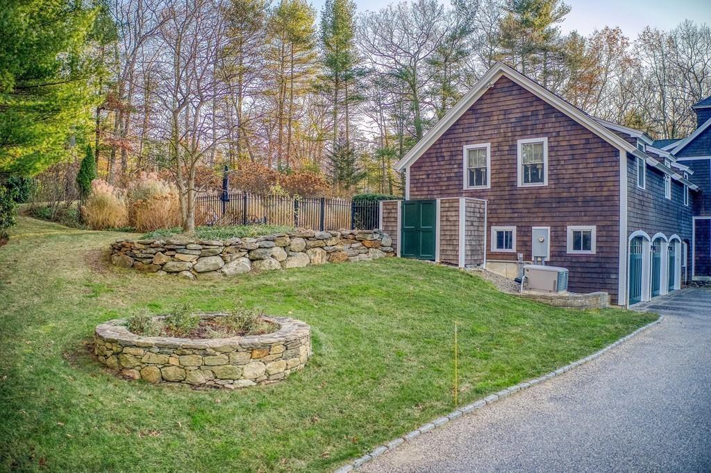 106 Koning Farm Road Carlisle, MA 01741 - Photo 32 of 39 a view of a house with a yard