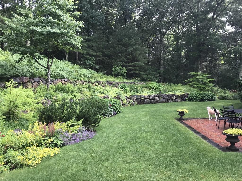 106 Koning Farm Road Carlisle, MA 01741 - Photo 33 of 39 a green field with lots of plants and trees