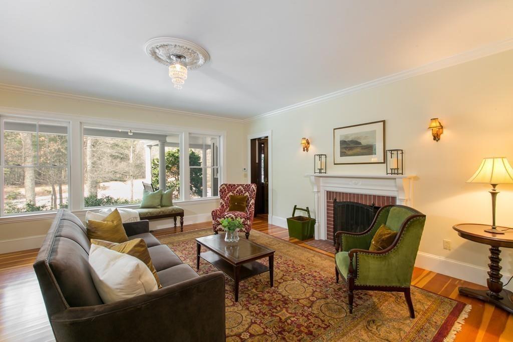 106 Koning Farm Road Carlisle, MA 01741 - Photo 10 of 39 a living room with furniture fireplace and a large window