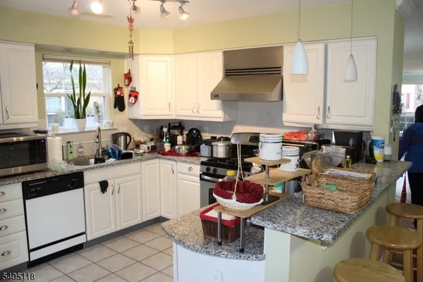 a kitchen with sink cabinets and window