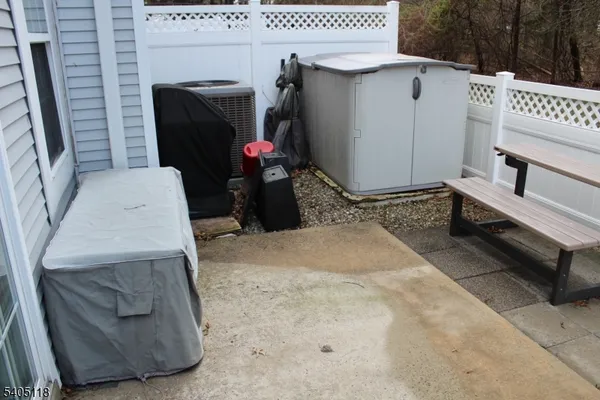 a spacious bathroom with a granite countertop tub a sink and a shower