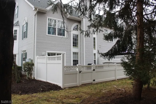 a view of a house with backyard