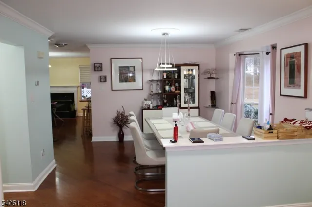 a living room with stainless steel appliances kitchen island granite countertop furniture and a kitchen view