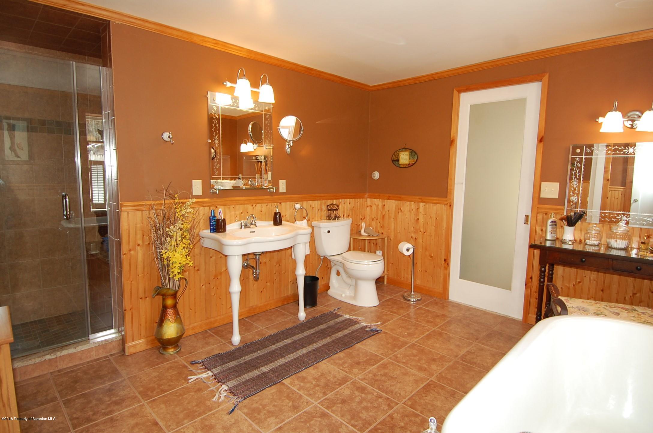 4126 State Rte 2012 Forest City, PA 18421 - Photo 21 of 66 a bathroom with a sink and a mirror