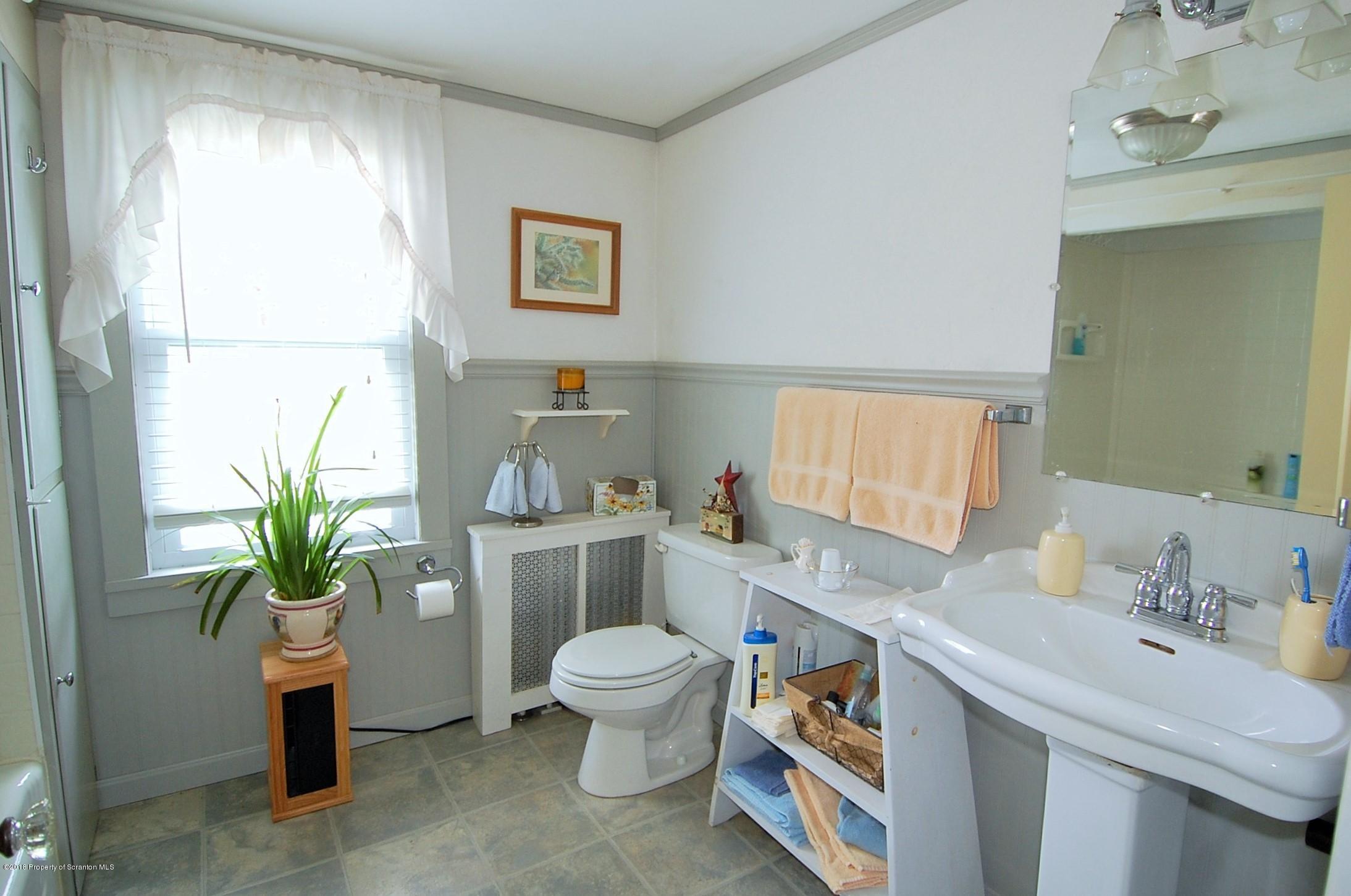 4126 State Rte 2012 Forest City, PA 18421 - Photo 31 of 66 a spacious bathroom with a granite countertop sink a toilet and a mirror