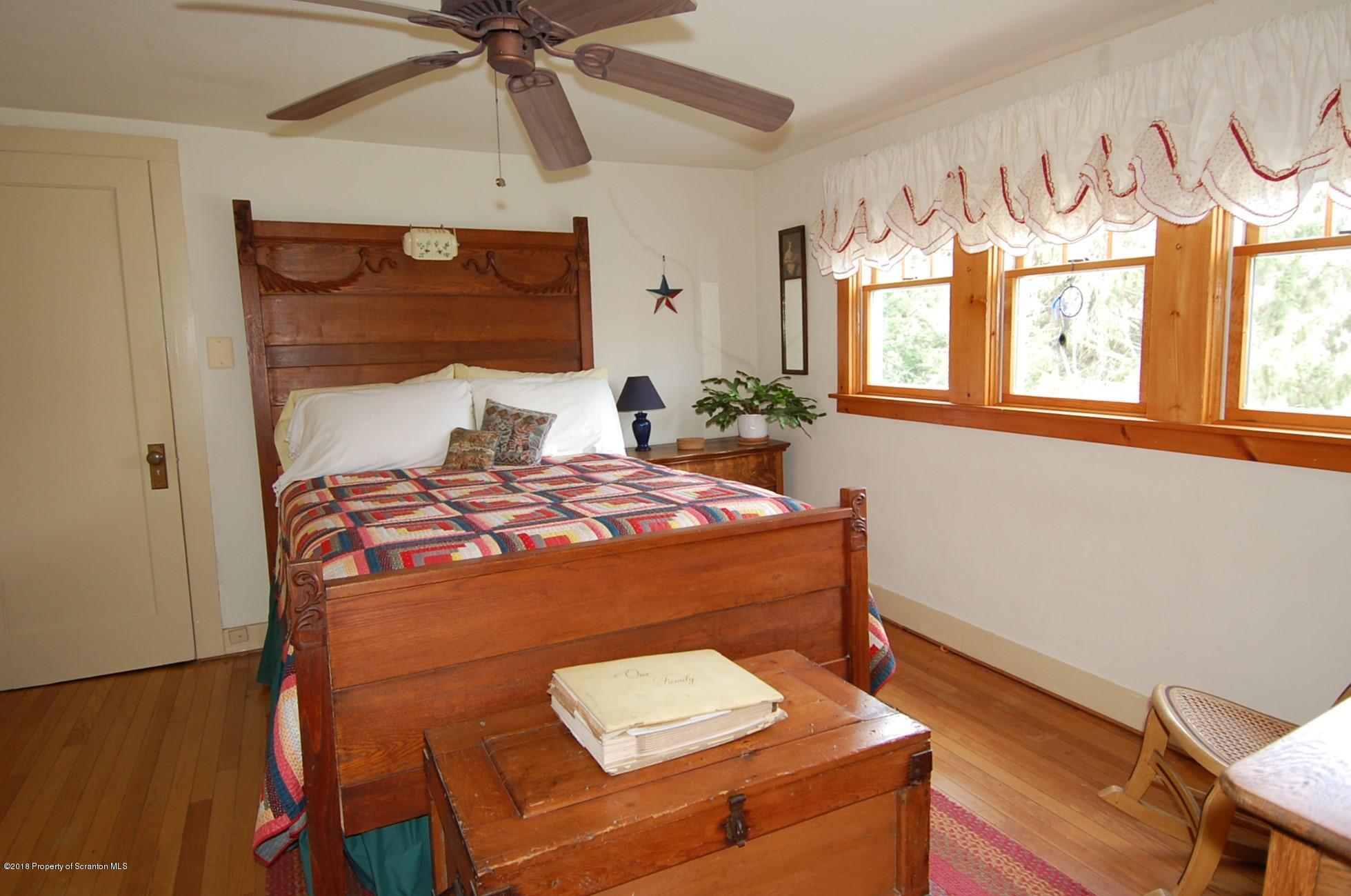 4126 State Rte 2012 Forest City, PA 18421 - Photo 34 of 66 a bedroom with a bed and a window