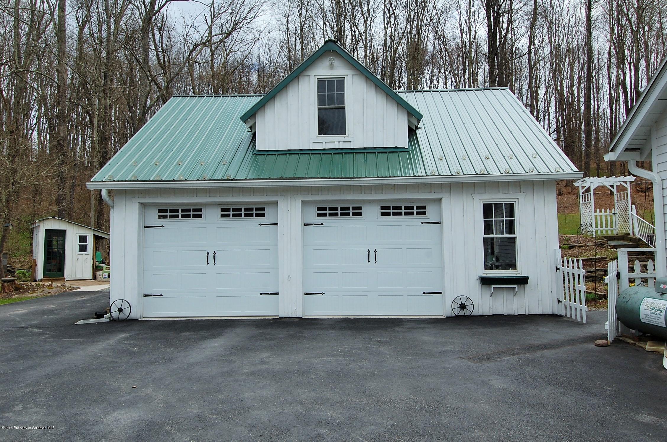 4126 State Rte 2012 Forest City, PA 18421 - Photo 36 of 66 a view of a house with a yard and garage