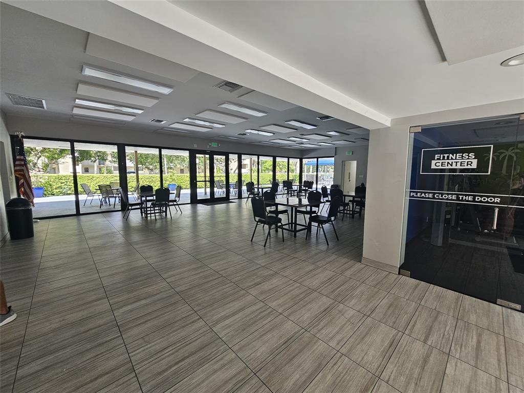 2450 DC Country Club Boulevard, Unit 203B Deerfield Beach, FL 33442 - Photo 12 of 19 a view of a room with lots of wooden furniture