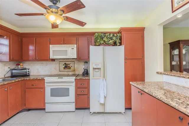 a view of balcony and dining area with furniture