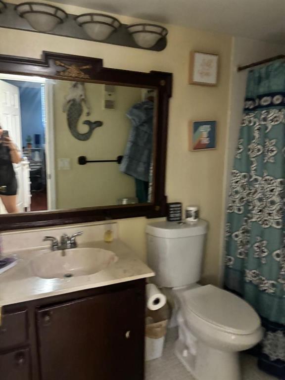2450 DC Country Club Boulevard, Unit 203B Deerfield Beach, FL 33442 - Photo 8 of 19 a bathroom with a sink and a toilet
