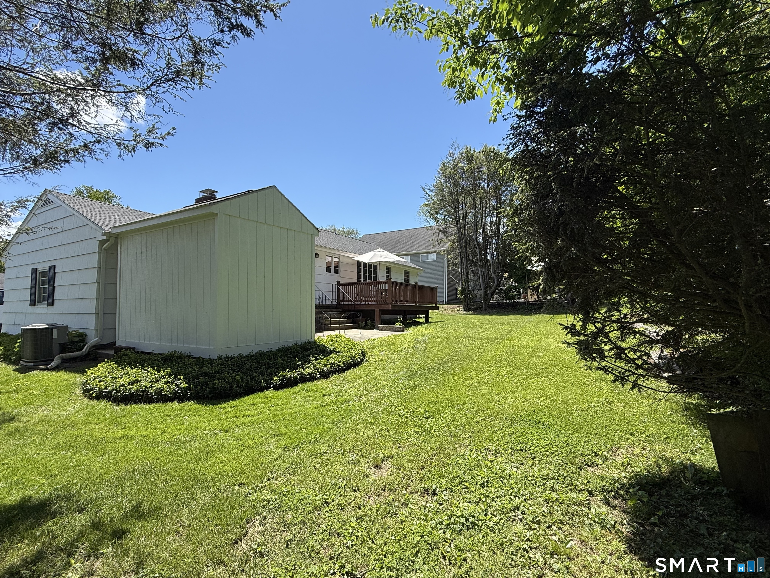 26 Maple Street Trumbull, CT 06611 - Photo 4 of 37 a view of a house with a backyard