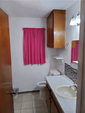 a view of a backyard with tree