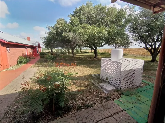 a backyard of a house with lots of green space