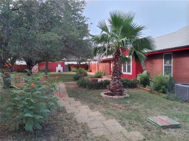 a view of backyard with green space