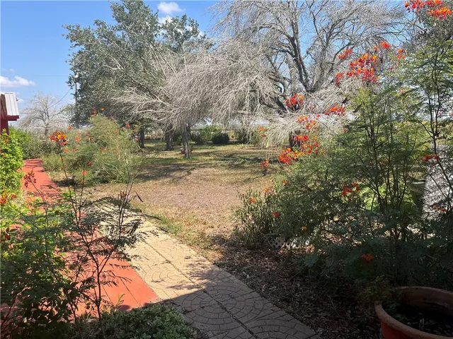 a white toilet sitting next to a shower
