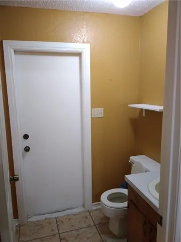 a view of a room with wooden walls