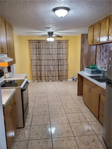 a view of a livingroom with a window and cabinet with wooden floor