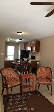 a bedroom with furniture and a wooden floor