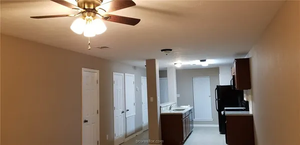 a view of a hallway with workspace