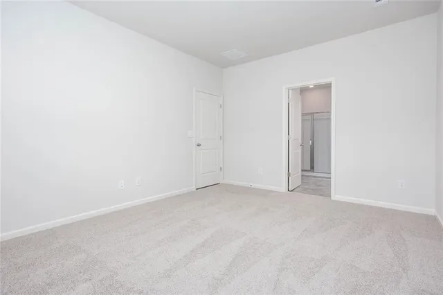 a view of an empty room and entryway