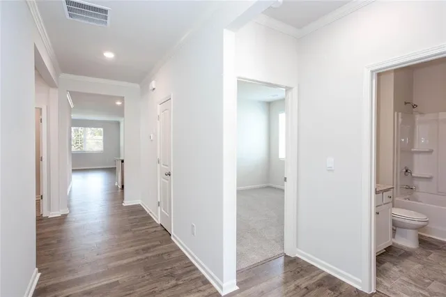 a view of a bathroom from a hallway