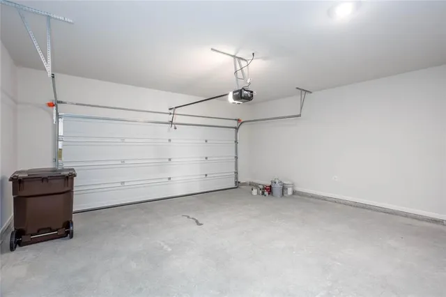 a view of an empty room with a ceiling fan