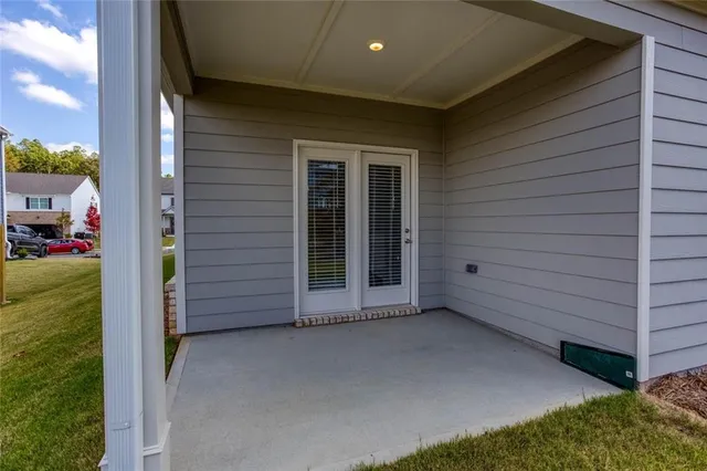 a view of an empty room with a sink and a yard