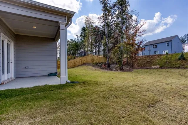 a view of a backyard of the house