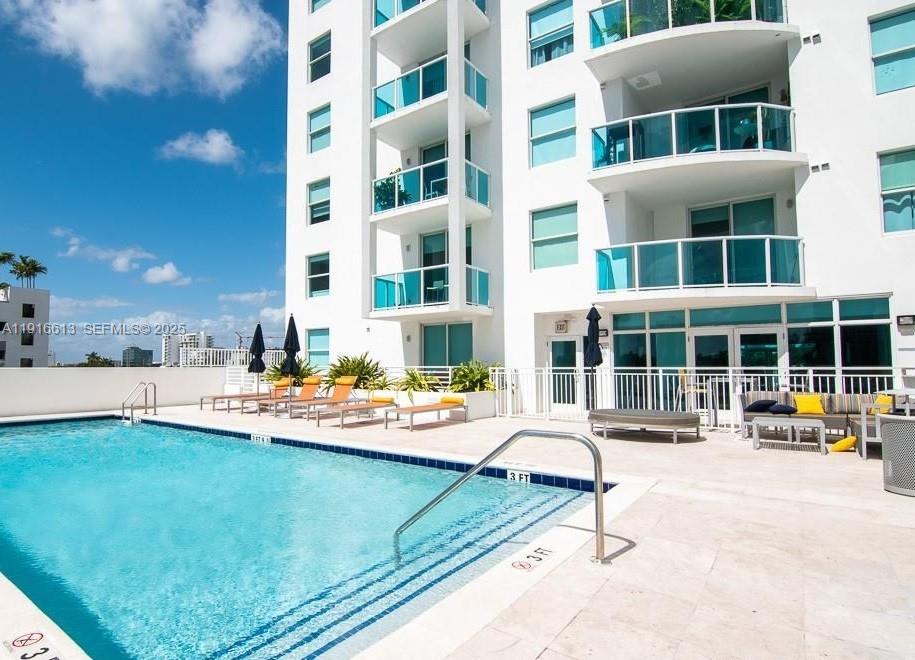 a view of a building with outdoor seating