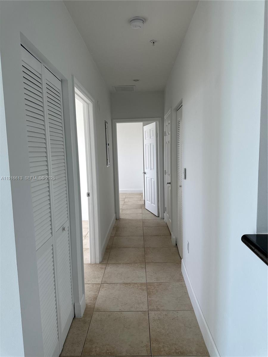 1723 Southwest 2nd Avenue, Unit PH09 Miami, FL 33129 - Photo 11 of 21 a view of a hallway to rooms