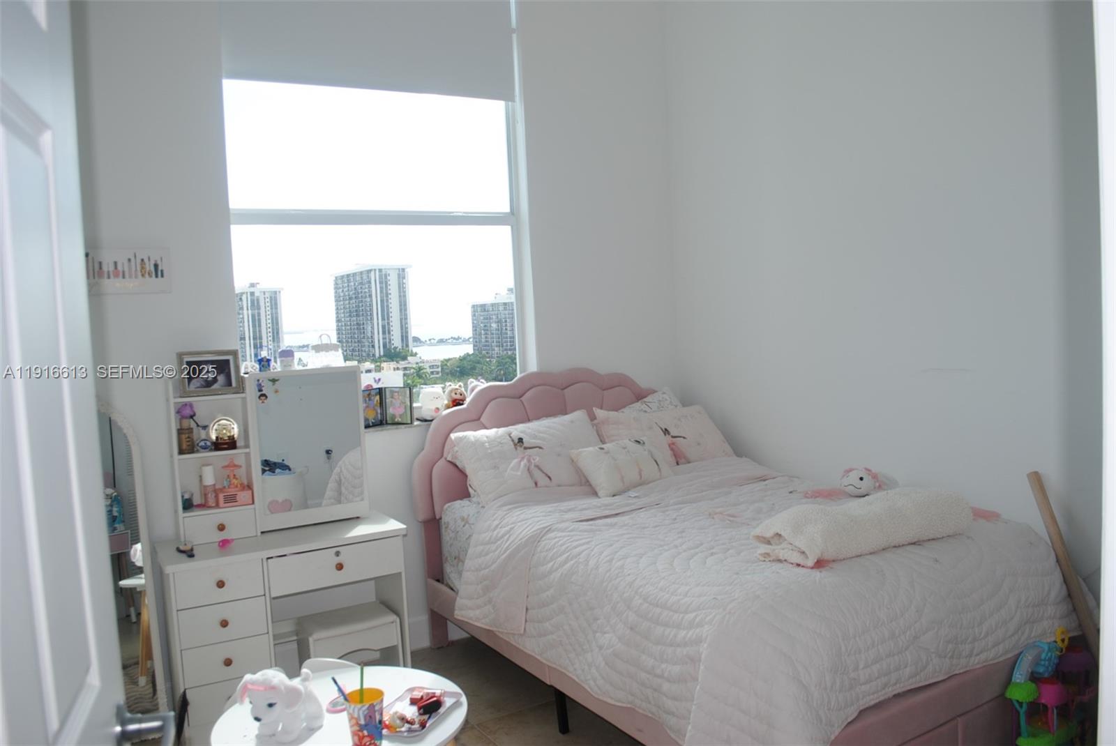 1723 Southwest 2nd Avenue, Unit PH09 Miami, FL 33129 - Photo 12 of 21 a bedroom with a bed and a window