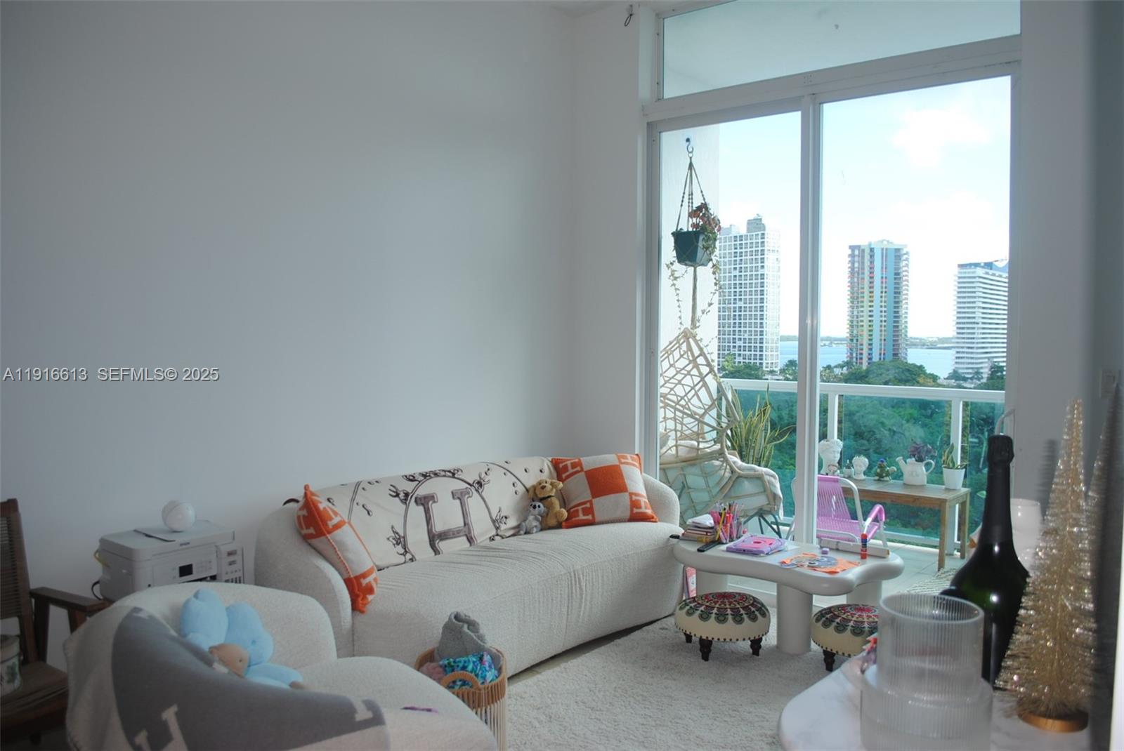 1723 Southwest 2nd Avenue, Unit PH09 Miami, FL 33129 - Photo 8 of 21 a living room with furniture and a window