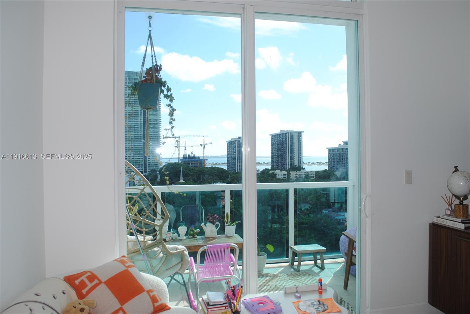 1723 Southwest 2nd Avenue, Unit PH09 Miami, FL 33129 - Photo 10 of 21 a balcony view with a floor to ceiling window and yard
